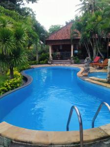 a swimming pool at a resort at Coral Bay Bungalows Amed Bali in Amed