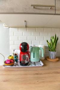 a kitchen counter with a coffee maker on a tray at Studio with Balcony in Paris