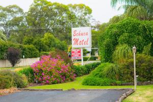 a sign for a celica motel on the side of a road at Echuca Motel in Echuca