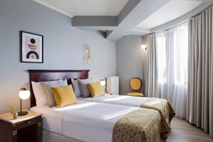 Lova arba lovos apgyvendinimo įstaigoje Hotel Venezia by Zeus International