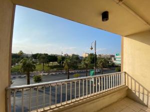a balcony with a view of a parking lot at Rest Park Hotel in Dammam
