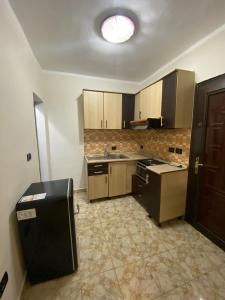 Kuchyň nebo kuchyňský kout v ubytování Cappuccino City Center Apartment
