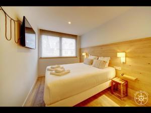 A bed or beds in a room at SANTA MARGALIDA de Alma de Nieve