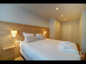 A bed or beds in a room at SANTA MARGALIDA de Alma de Nieve