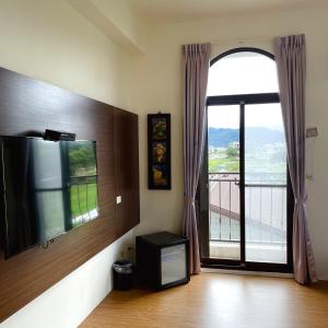 Sjónvarps- og/eða afþreyingartæki á Landay Homestay