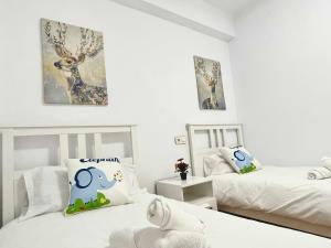 Posteľ alebo postele v izbe v ubytovaní Apartamento en el centro de Malaga, en el Soho
