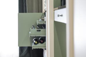 a room with two speakers in a wall at Hotel La Gemma in Florence