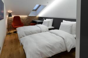 Postel nebo postele na pokoji v ubytování Dunten Hotel