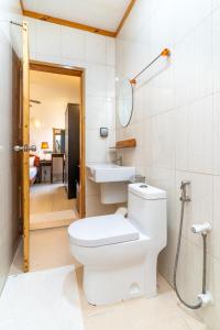 a bathroom with a toilet and a sink at Ukulhas View in Ukulhas