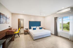 Postel nebo postele na pokoji v ubytování Regency Tuticorin by GRT Hotels