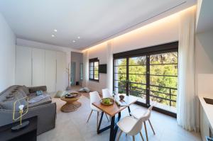 a living room with a couch and a table at Naillac Elite Suites in Rhodes Town