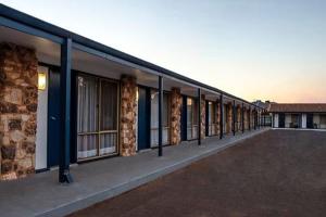 a long row of windows on a building at Kalgoorlie Overland Motel in Kalgoorlie