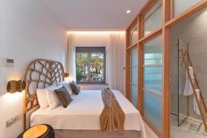 Posteľ alebo postele v izbe v ubytovaní Naillac Elite Suites