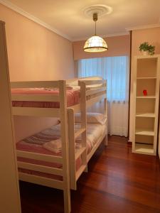 Łóżko lub łóżka w pokoju w obiekcie Casa Goros I
