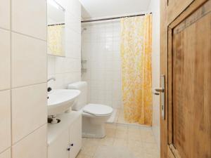 a bathroom with a toilet and a sink at Apartment Mirabeau by Interhome in Les Collons
