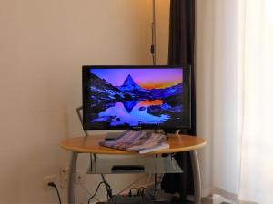 TV i/ili multimedijalni sistem u objektu Apartment Select by Interhome