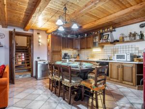 a kitchen with a table and chairs in a room at Holiday Home Casa Ivan by Interhome in Noasca