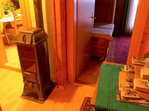 a hallway with a room with a door and a table at Apartment Lärchenheim by Interhome in Gasenried +11 photos