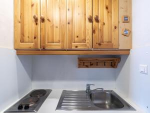 Cuisine ou kitchenette dans l'établissement Apartment Le 2100 A et B-1