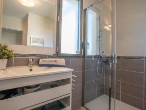 a bathroom with a sink and a shower at Apartment Rive Gauche by Interhome in Fréjus