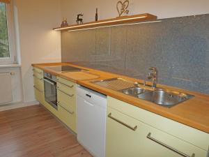 a kitchen with a stainless steel sink and a counter at Apartment Isolde by Interhome in Reith bei Seefeld