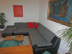 a living room with a couch and a table at Apartment Isolde by Interhome in Reith bei Seefeld