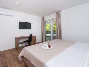 Ein Bett oder Betten in einem Zimmer der Unterkunft Holiday Home Villa Loreta by Interhome