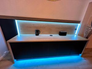 a wooden shelf with a light on it at Le bohème in Noisseville +29 photos