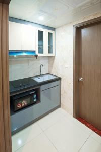 a kitchen with a sink and a counter top at Viet Long Complex Residence in Bắc Ninh +44 photos