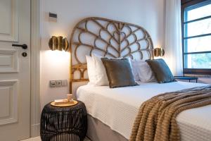 Posteľ alebo postele v izbe v ubytovaní Naillac Elite Suites