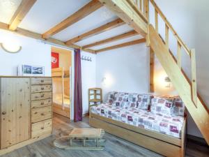 a bedroom with a bed and a staircase in a room at Apartment Rond Point des Pistes - Val Claret-20 by Interhome in Tignes