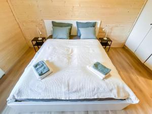 a bed in a room with two pillows on it at Holiday Home The cozy loggers suite by Interhome in Salla