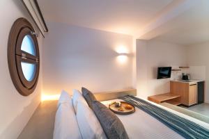 Posteľ alebo postele v izbe v ubytovaní Naillac Elite Suites