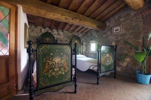 A bed or beds in a room at Molino in chianti