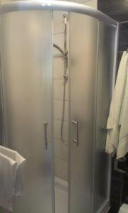 a shower with a glass door in a bathroom at Motel Luka in Deževice +42 photos
