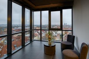 a room with a view of a city at Panorama Hotel Schweinfurt in Schweinfurt