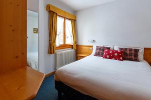 A bed or beds in a room at Residence Sci Sport