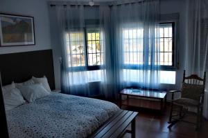 A bed or beds in a room at Casa Las Piedras.