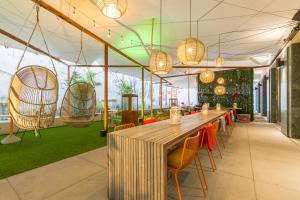 a dining room with a table and chairs and swings at A-STAY Antwerp in Antwerp