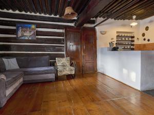 a living room with a couch and a table at Holiday Home Paseky nad Jizerou by Interhome in Paseky nad Jizerou