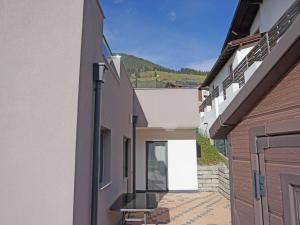 a view of a hallway between two buildings at Apartment FeWo Anna by Interhome in Fliess