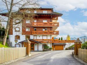 a building with a balcony on the side of a road at Apartment Ambre 1 by Interhome in Villars-sur-Ollon