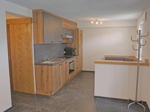 A kitchen or kitchenette at Apartment Apart Handle by Interhome Még 29 kép