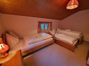 an overhead view of two beds in a room at Apartment Lieptgas by Interhome in Lenzerheide