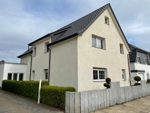 a house with a fence in front of it at Apartment Nordlicht by Interhome in Bremerhaven