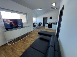 A television and/or entertainment centre at Chalet Diamondsky by Interhome