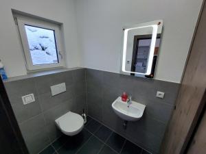 A bathroom at Chalet Diamondsky by Interhome