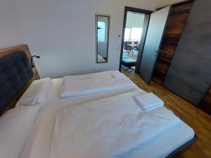 A bed or beds in a room at Chalet Diamondsky by Interhome