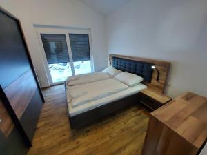 A bed or beds in a room at Chalet Diamondsky by Interhome