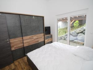 A bed or beds in a room at Chalet Diamondsky by Interhome